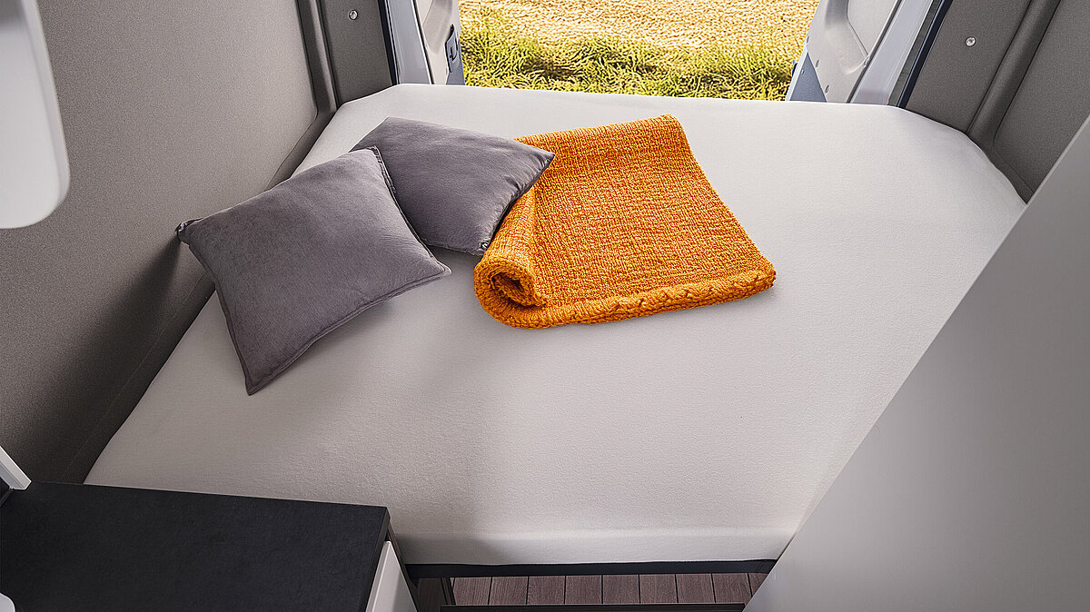 Double bed across the rear of the VANTourer 600 Ds