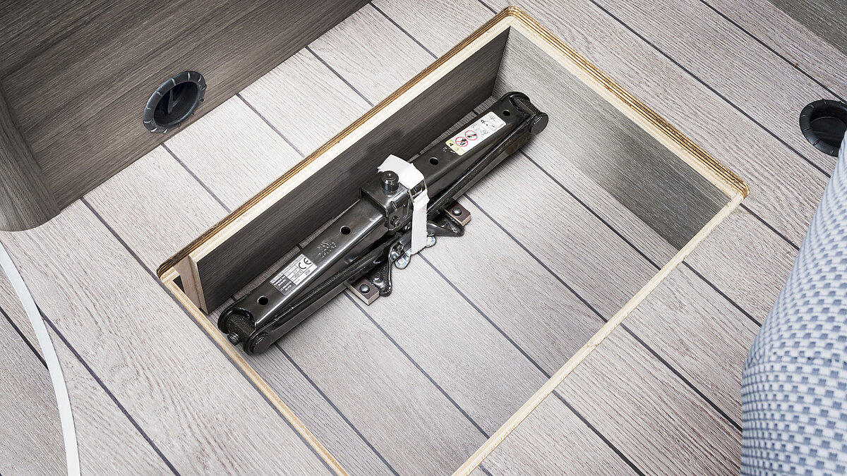 Jack in recessed compartment below the table